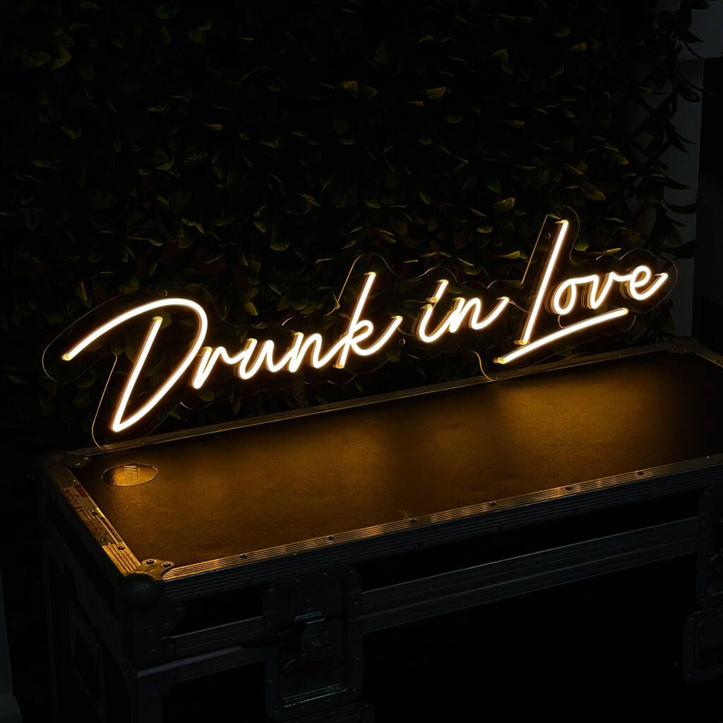 the Drunk In Love wedding neon sign from ManhattanNeons.com looks great in the dark, adding a romantic glow to your celebration.