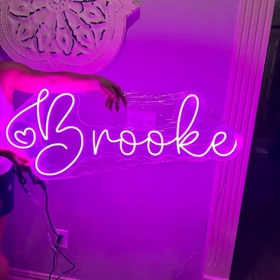 Glowing with personality, the Brooke name neon sign is a perfect addition to any room - from manhattonneons.com.