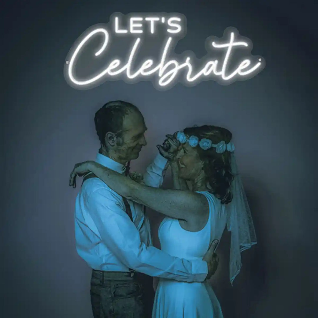 Let's Celebrate Wedding Neon Sign - An illuminated invitation to celebrate love's journey, adding warmth to any wedding festivity - from manhattonneons.com