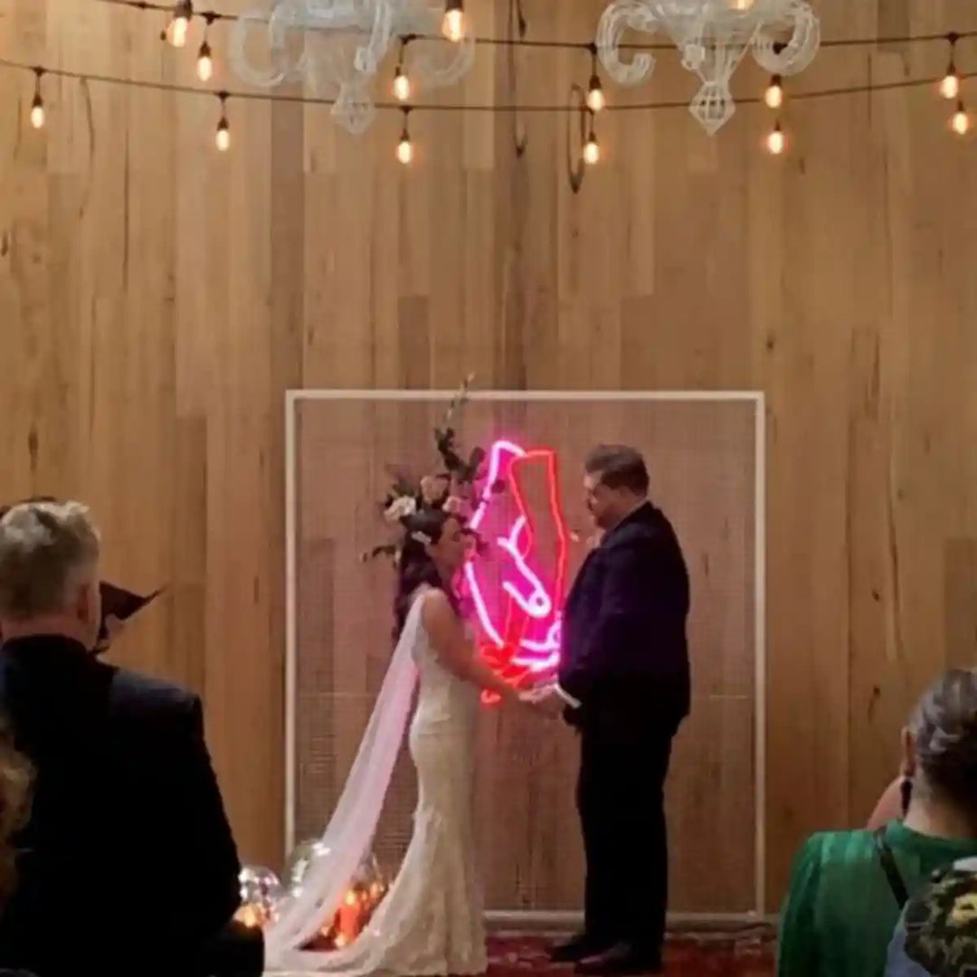 Love Holding Hands Wedding Neon Sign - A heartfelt portrayal of love, symbolized by intertwined hands, ideal for wedding celebrations - from manhattonneons.com