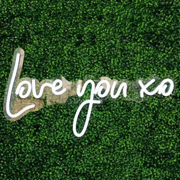 Love You More xx Wedding Neon Sign depicted in a glowing display of affection, radiating warmth and charm - from manhattonneons.com 