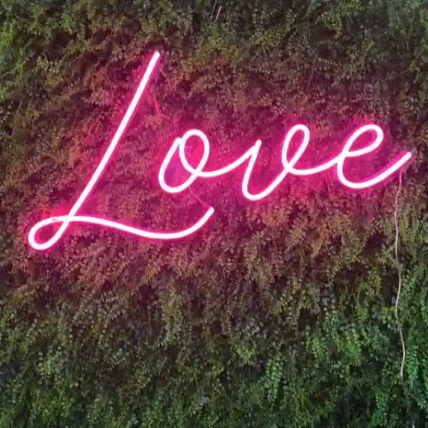 Modern Love Wedding Neon Sign glowing brightly in the night, symbolizing eternal love - from manhattonneons.com