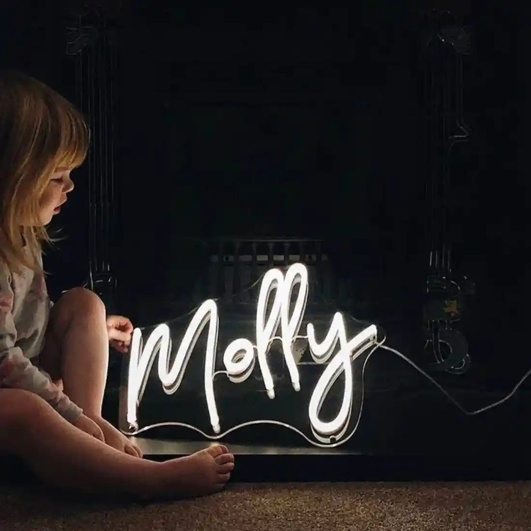 molly-name-neon-sign adds a pop of color to any space - from manhattonneons.com