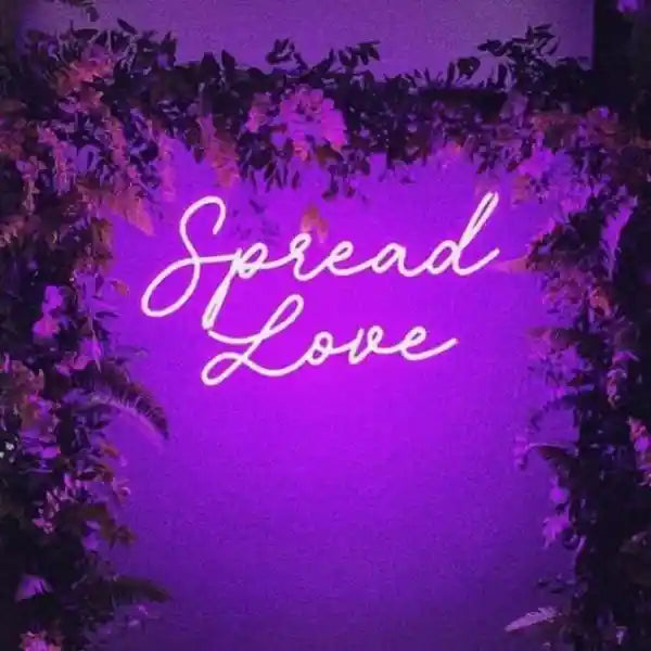 Spread Love Wedding Neon Sign - An enchanting display of glowing neon lights spreading love and warmth into the night from manhattonneons.com 