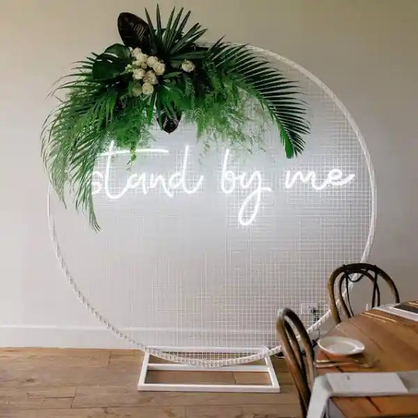 Stand by Me wedding neon sign glowing in the dark, radiating love and commitment - from manhattonneons.com 