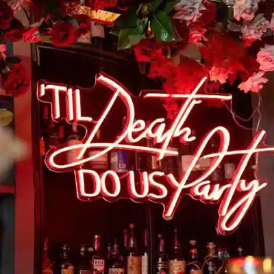 Till Death Do Us Party Wedding Neon Sign - A vibrant and playful neon sign glowing with a promise of everlasting celebration and joy. - from manhattonneons.com